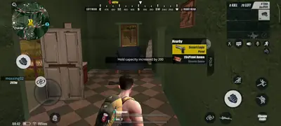 Looting inside a house on Ghillie Island in ROS Legacy, picking up a Desert Eagle pistol and ammunition